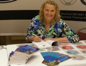 Ina Oostrom signs her book